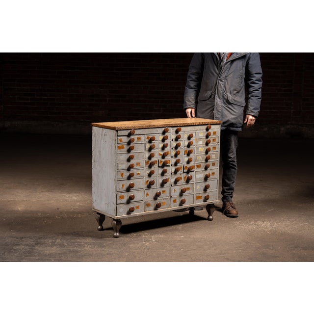 Large-scale multi-drawer industrial storage cabinet constructed with a painted wood case, solid oak top, and original...