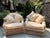 This elegant pair of vintage braided rattan lounge chairs exemplifies the effortless charm and relaxed sophistication of...