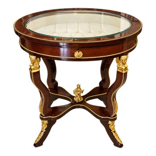 French-Style Oval Side Table – Glass Top, Rich Wood Finish & Ornate Gold Leaf Details For Sale