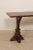 A French fruitwood console table with unusual legs. This contemporary table from France features a rectangular-shaped top...