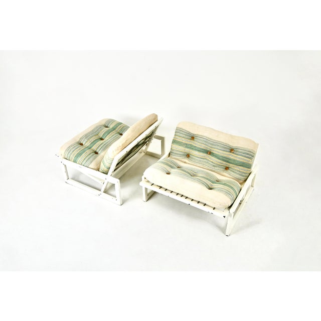 Pair of wooden armchairs and cushion in green and white fabric by Afra and Tobia Scarpa for Cassina, Carlotta model. Seat...