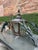 Large Cast Iron and Copper Entryway Gas Lantern, 20th c., with a turned finial top over tapered glass sides, on double...