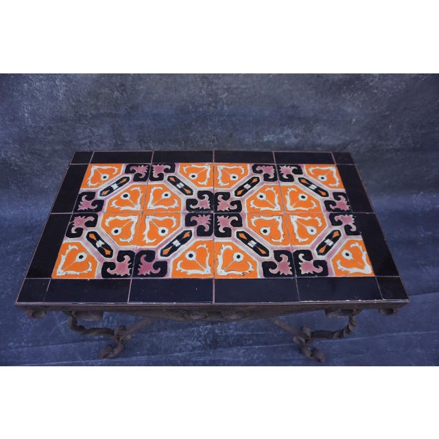 An original D&M tile-top table, circa 1927, featuring a richly patterned surface in an uncommon and striking color palette...