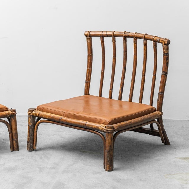 Pair of armchairs. Designed by Alberto Smania and produced by Smania Studio Interni in the 1970s. Wooden frame with brown...