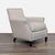 Beige upholstered lounge chair with dark wood legs and nailhead trim. Brand: Lillian August Couture . Original Price:...