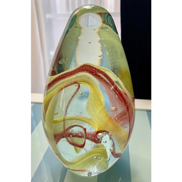 ecea wonderful deciorative or practical piece - the Clear glass with red and yellow ribbons are wonderful in it's tall...