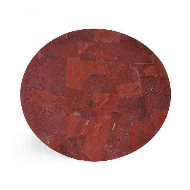 The table's top is expertly crafted from genuine Red Jasper, a semi-precious stone renowned for its deep red hues and...