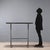 This 1990s console table features an iron frame that lends solidity and an industrial feel. The red lacquered wood top...
