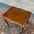 A vintage Knob Creek Traditional Queen Anne solid cherry side table having a scalloped and beveled top over carved...