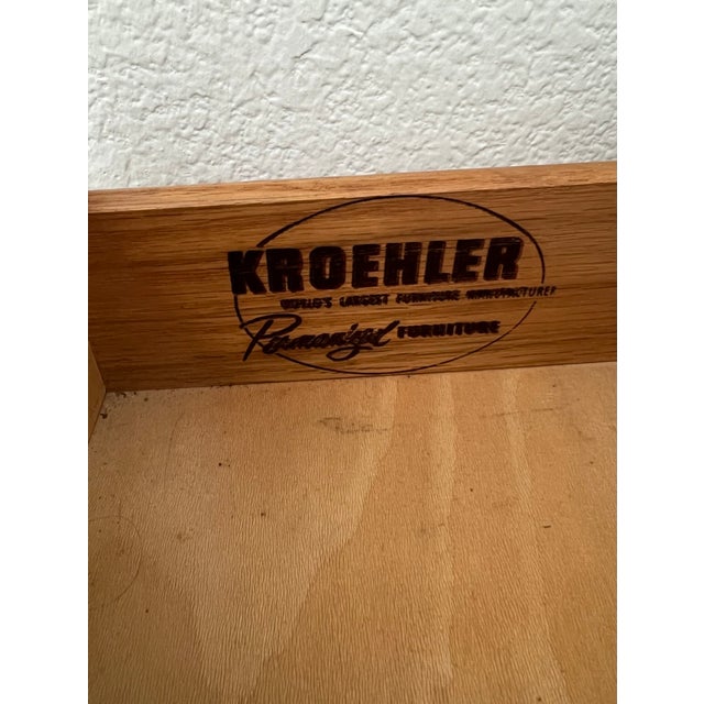 This is a vintage Mid-Century Modern tall dresser / highboy chest manufactured by Kroehler. The chest features five...