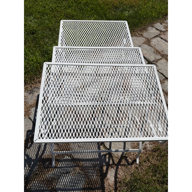 This set of three mesh topped stacking or nesting tables has been recently refurbished, ready for use outdoors or inside....