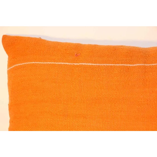 Custom Berber pillow cut from a vintage handwoven wool Moroccan tribal flat-weave Kilim tribal rug.Handwoven by the Berber...