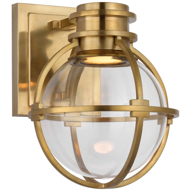 Gracie Single Sconce in Antique-Burnished Brass with Clear Glass Designer: Chapman & Myers Height: 8.75" Extension: 8.25"...