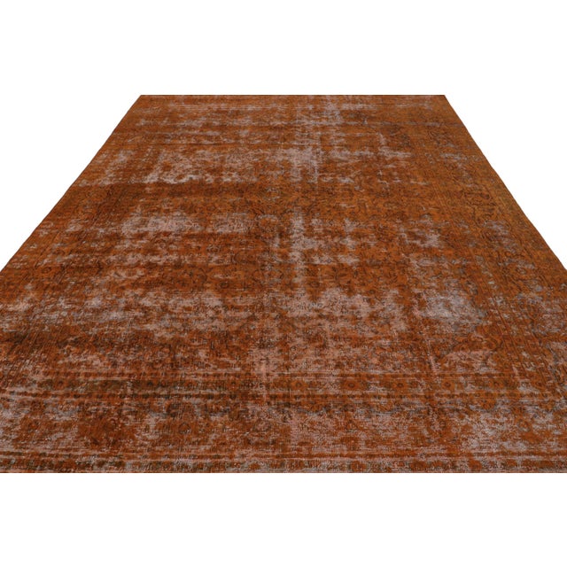 From our new collection of overdyed rugs, a vintage 9x12 Persian rug originating circa 1970-1980 or possibly earlier. On...