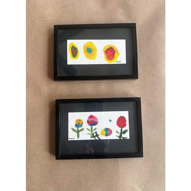 A charming and whimsical set of two original watercolor paintings featuring playful, simplified floral and organic forms....