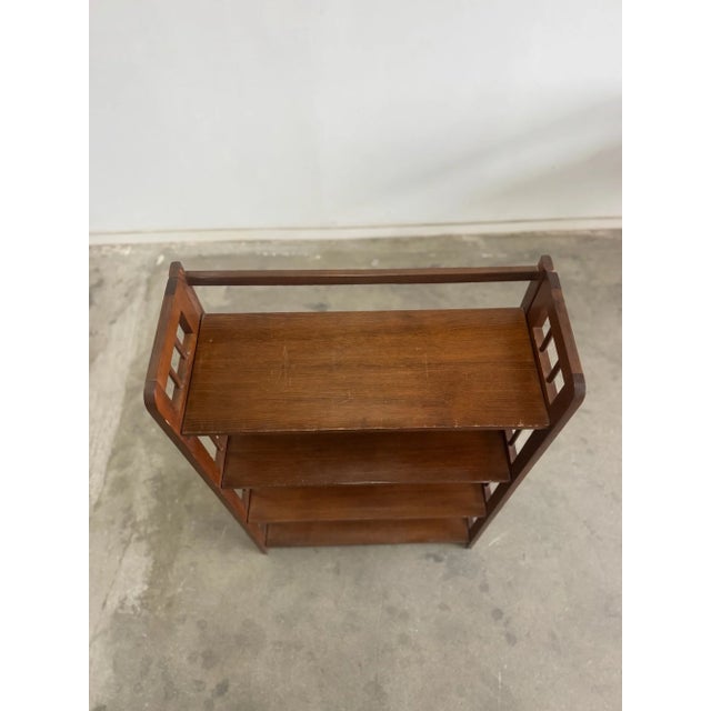 W28 D11.5 H46 SHELF H11.5 This petite charming craftsmen style shelving unit features 4 shelves crafted from solid wood....