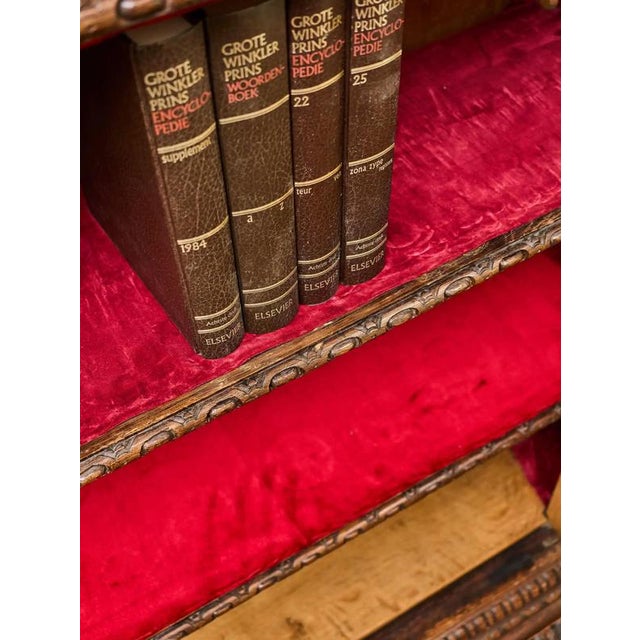 Representative two-door bookcase made of solid oak, created in the second half of the 19th century in a rich Renaissance...