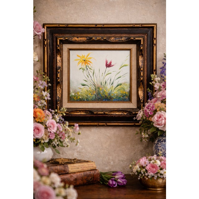 This expressive floral oil painting brings texture and movement to a space, offering a quiet yet engaging presence suited...