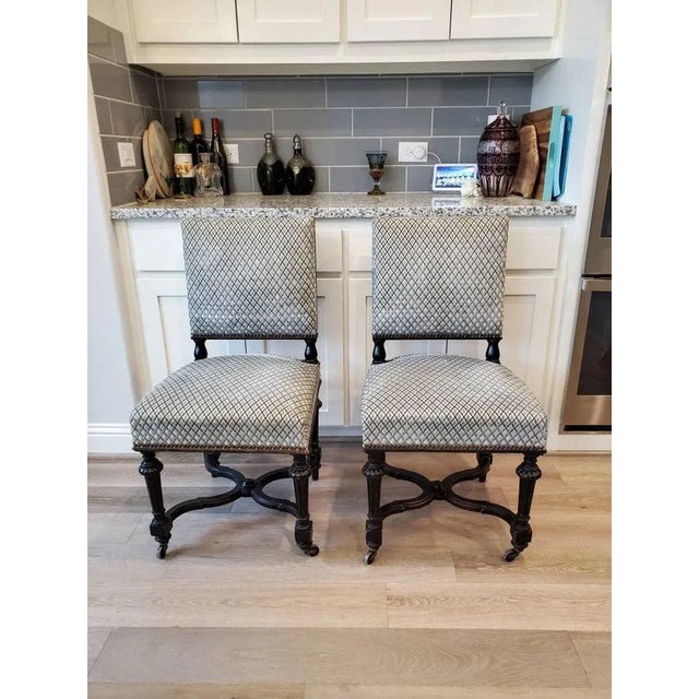 A rare set of four period Napoleon III Second Empire dining chairs, hand-crafted of solid fruitwood in France in the third...