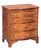 A fine English bachelor's small chest of drawers (or side chest) from the Edwardian era, featuring a moulded, shaped top...