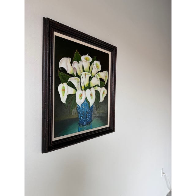 A charming vintage folk art oil on board painting by Graceli Mendoza depicting an elegant bouquet of white calla lilies...