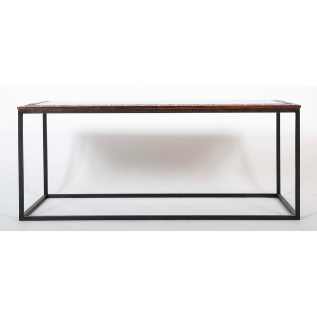 Anglo Indian coffee table, rosewood top with exquisite marquetry inlay on a custom steel base. This handsome coffee table...