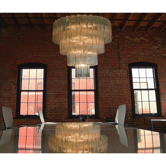 Pair of Italian vintage chandeliers in Murano glass and nickel-plated metal structure on 4 levels. The armor polished...