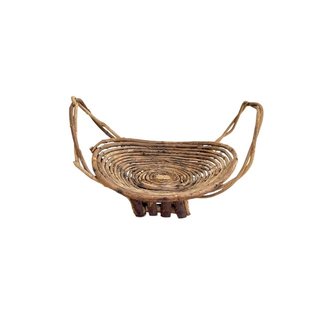 A wonderfully sculptural mid-20th century French grapevine gathering basket featuring an unusual open lattice construction...