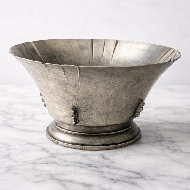 An exceptional Art Deco pewter bowl designed by Sylvia Stave for CG Hallberg, Sweden, circa 1934. This sculptural piece...