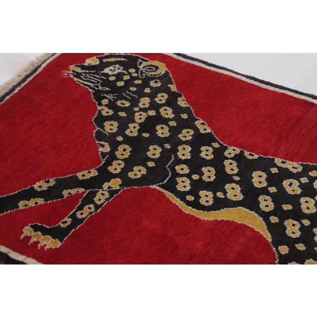 Hand-knotted in wool and originating circa 1950-1959 from Afghanistan, this 3x4 vintage Afghan Gabbeh rug joins Rug &...