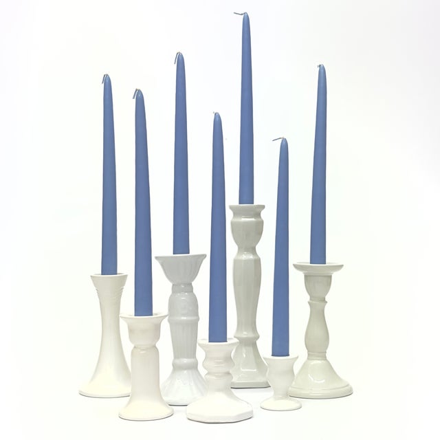 Assorted white candle holders, group of 7. This beautiful set of white vintage ceramic candle holders comes in an...