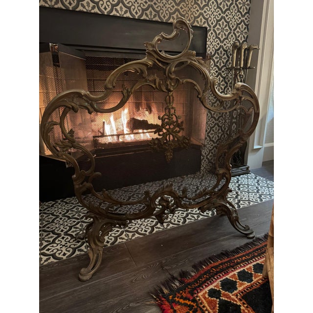 Stunning, collectible 19th-century French Louis XV style brass (bronze) fireplace screen The design features ornate Rococo...