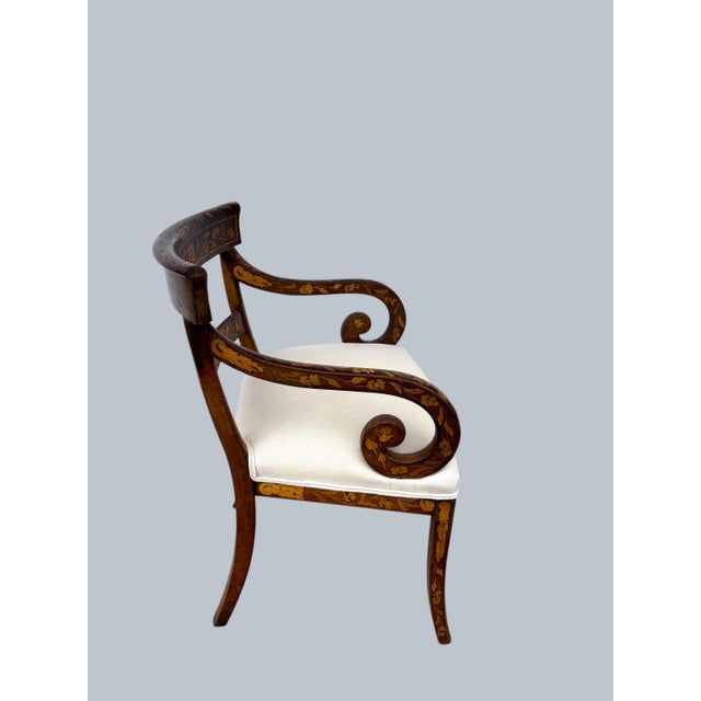 A fine early Armchair from the regency period. Nicely inlaid in the typical Dutch Marquetry style. Scroll arms, splayed...