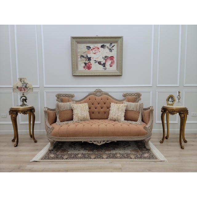 Elevate your space with this stunning French Rococo–inspired vintage sofa, featuring elegant deep tufted upholstery framed...