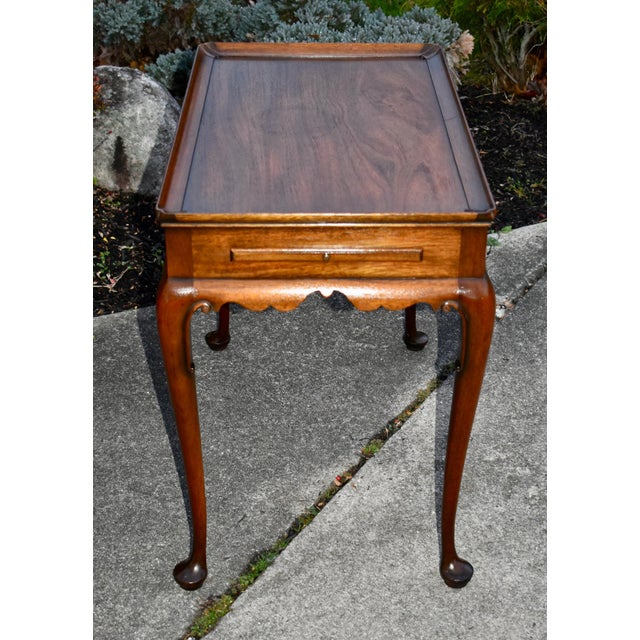 Vintage (1960's) Tea Table with Pull-Outs has a Queen Anne Style. The Wood is Mahogany. Scalloped Edge and Cabriole Legs....