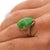 10.01 Carat Natural jadeite jade ring featuring large oval cabochon in 18K yellow gold four-prong setting. Translucent...