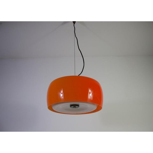 This striking mid-century pendant lamp was produced by the renowned italian lighting manufacturer stilnovo in the 1960s....