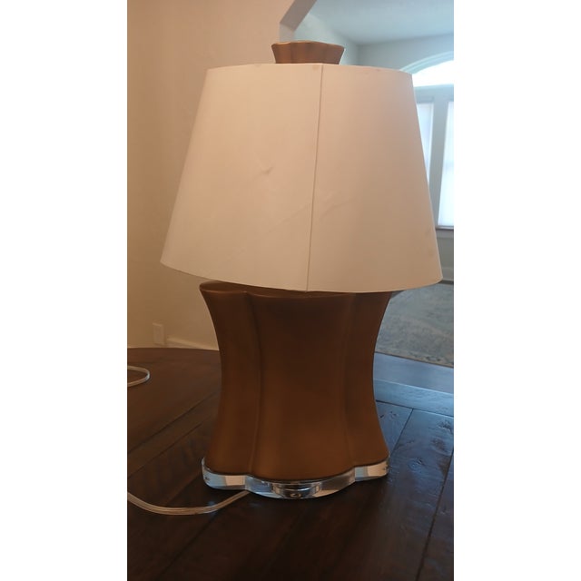 Roger Thomas Collection by Studio A Table Lamp — Gold Leaf Resin Body with Lucite Base A sculptural statement lamp from...