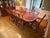 Elevate your dining space with this exquisite authentically crafted 9-piece traditional dining set by Ethan Allen....
