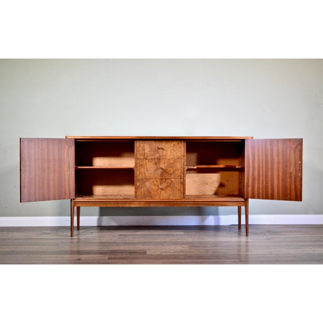 Brass and Walnut Sideboard from Vanson, 1960s, in Very Good conditions. Designed 1960 to 1969 This piece has an...