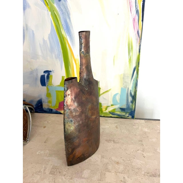 Excellent vintage 20th Century hand forged metal vase. It has a very thin profile and two necks, one being much taller...