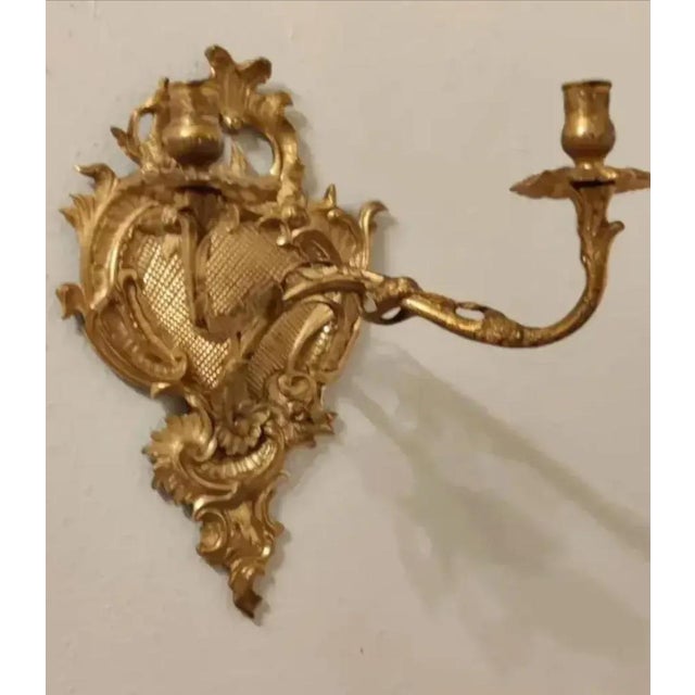 For your consideration. . . A gorgeous ornate pair of antique gilt bronze French Rococo wall sconces. Each double arm...