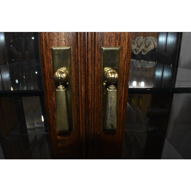 Fantastic pair of Chinoiserie curio cabinets made by Thomasville from their Mystique collection. Made of solid wood with...