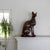This larger-than-life-size bronze-plated brass cat statue depicts Bastet, the Egyptian Goddess of home, fertility, and...