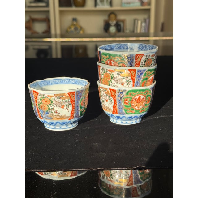 Set of 4 Antique Japanese Imari Porcelain Tea Cups — Meiji Period, Scalloped Rim A matched set of four hand-painted...