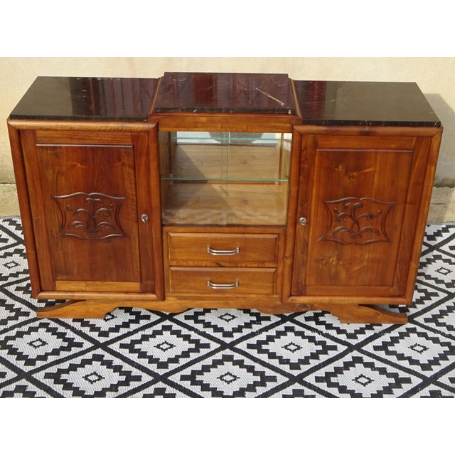 A beautiful art deco sideboard crafted entirely from solid walnut. Its clean, simple lines make it suitable for any...