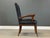 A mid century modern black vinyl tufted office desk chair with refinished walnut legs. Circa 1960’s. Made in USA. Seat...