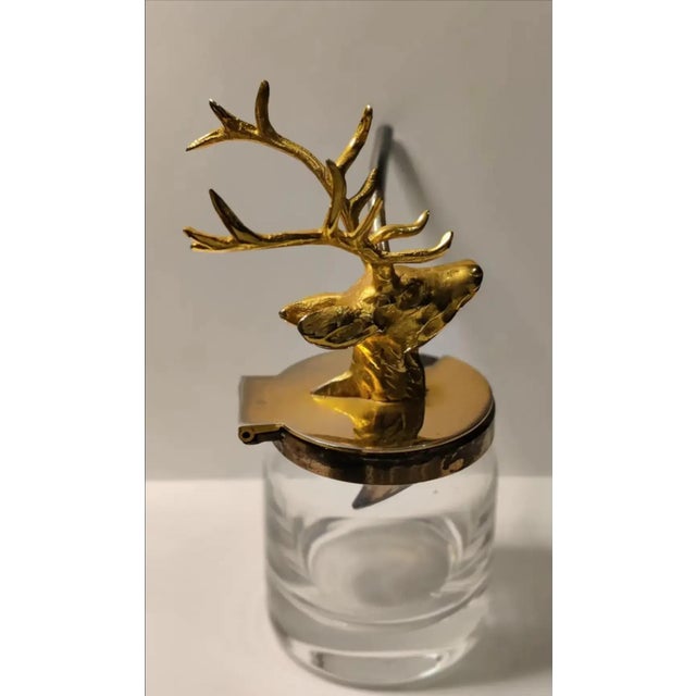 For your consideration. . . A small figural mustard pot in the form of a stag's head. The top of the mustard pot features...