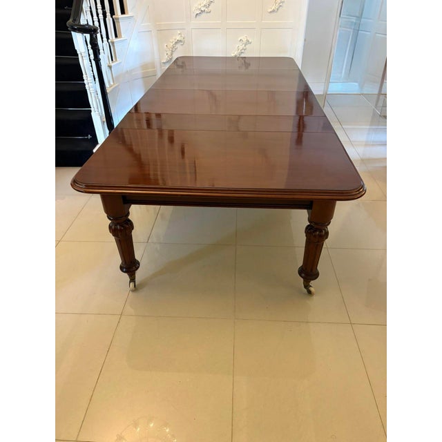 Large antique Victorian quality figured mahogany 12 seater extending dining table having a quality figured mahogany top...