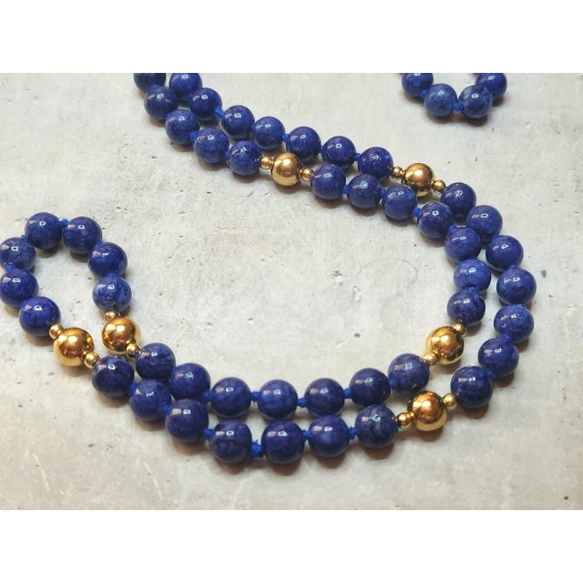 The length of the necklace is 30 inches (76 cm). The size of the smooth round sodalite beads is 8 mm, the size of the...
